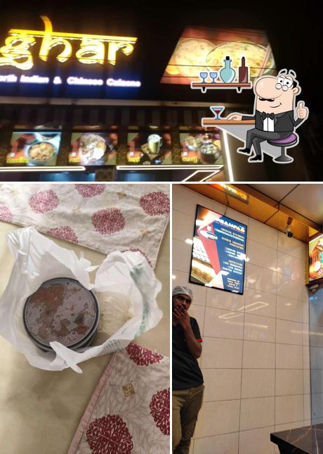 Take a seat at one of the tables at New Welcome Tea & Fast Foods