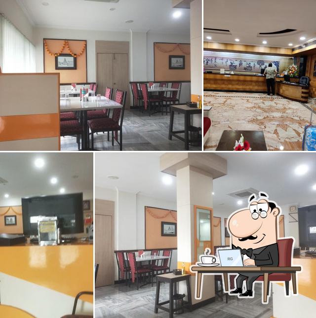 Take a seat at one of the tables at Amirtham