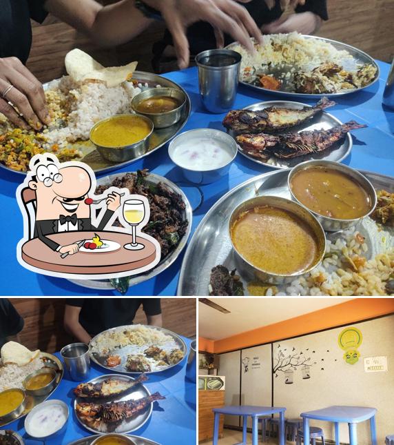 Check out the photo showing food and interior at Amrutha Mess