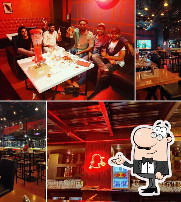 Take a seat at one of the tables at Sherlock's - Lounge & Kitchen Hyderabad