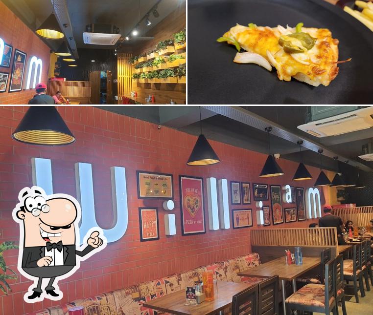 Check out the picture depicting interior and food at William John's Pizza
