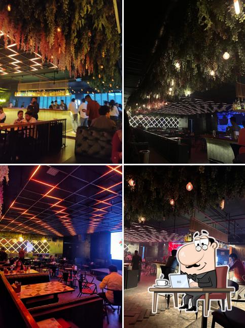 Take a seat at one of the tables at The Orange Mint Lounge - Powai