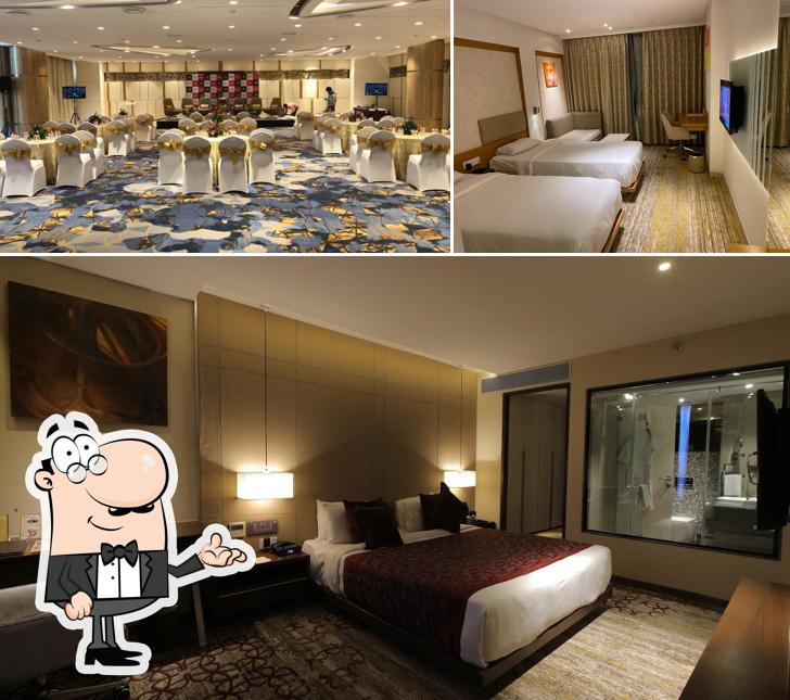 Take a seat at one of the tables at Sayaji Hotel Vadodara Take a seat at one of the tables at Sayaji Hotel Vadodara