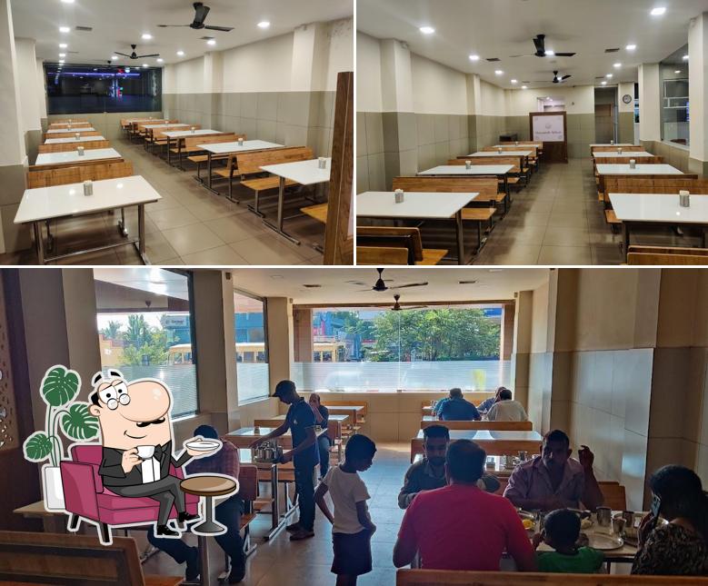 Take a seat at one of the tables at Vasantha Vihar Nileshwaram