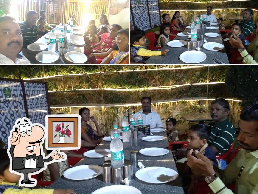 Take a seat at one of the tables at Ismail bhai's hotel khan chacha ( family Garden restaurant )