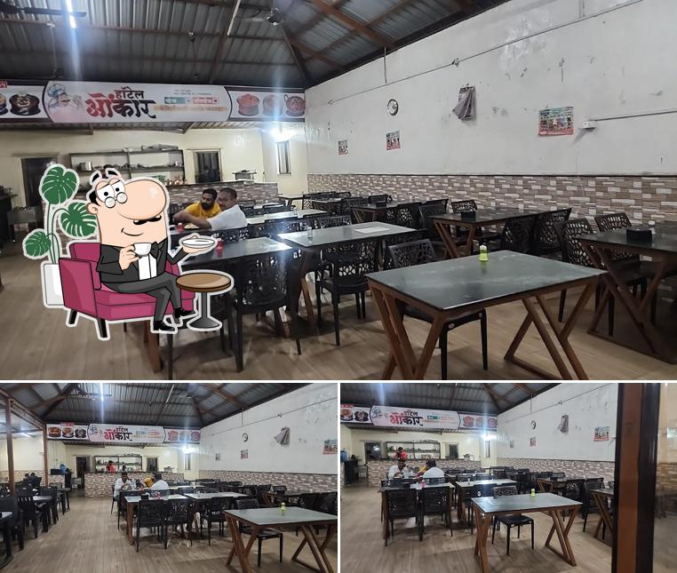 Take a seat at one of the tables at Omkar pure ve& Lonavala chakki