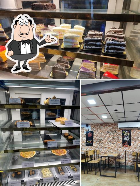 Take a look at the photo showing interior and food at The Cake Shop - Periyar Nagar