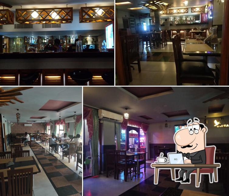 Take a seat at one of the tables at Soma Bar & Restaurant