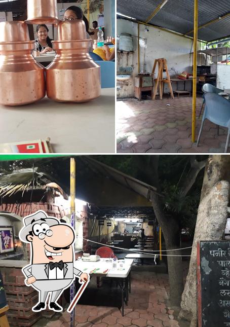 The picture of exterior and beverage at Hotel Nupur