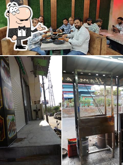 Take a seat at one of the tables at Hamza Non Veg Restaurant