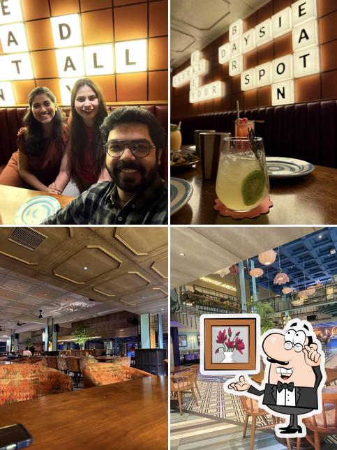 Take a seat at one of the tables at Daysie (MG Road) : All Day Casual Bar