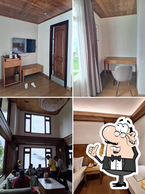 Take a seat at one of the tables at Grains Pure Veg by Udaan Pine Crest, Pelling