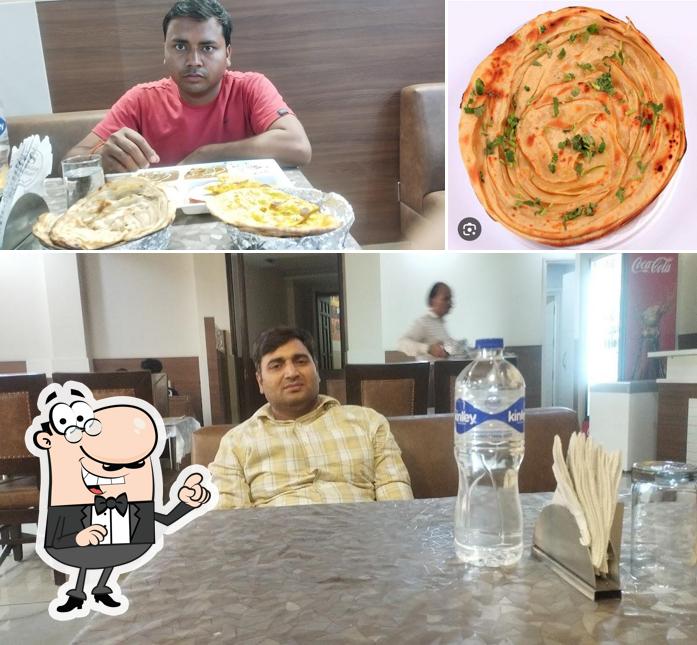 Check out the photo displaying interior and food at Sukh Sagar Restaurant