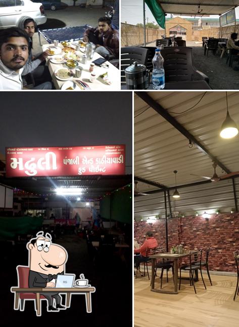 Take a seat at one of the tables at Madhuli Kathiyavadi & Punjabi