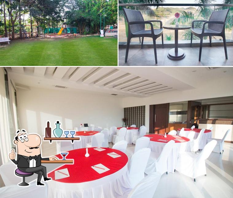 Take a seat at one of the tables at 7 Apple Resort - Lonavala