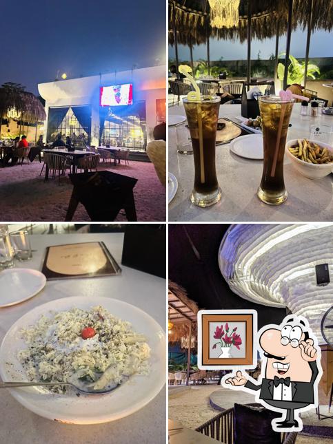 Take a seat at one of the tables at CaroBar - Multicuisine Restaurant Bar Cafe