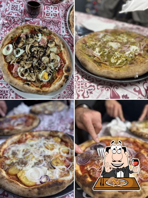 A Pizzeria Trattoria Al Ritrovo, puoi goderti una bella pizza