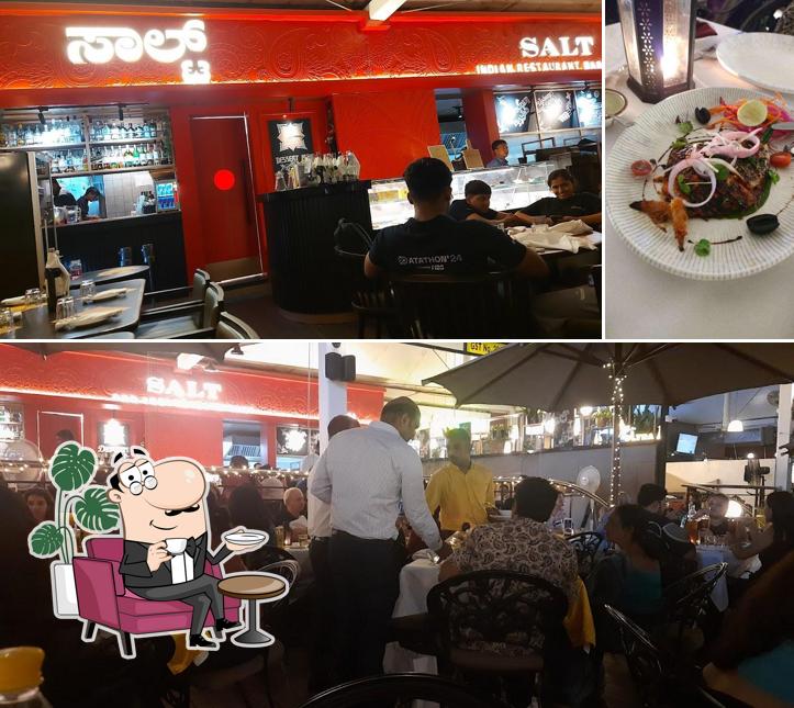 Take a seat at one of the tables at SALT - Indian Restaurant Bar & Grill