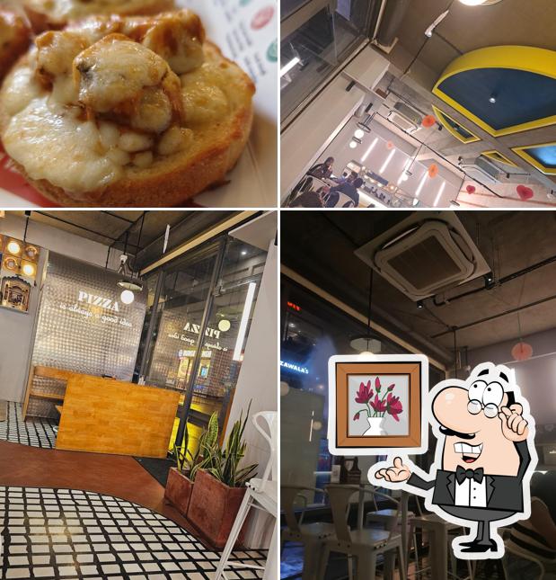 The picture of interior and food at La Pino'z Pizza, Maruti Solaris Annex