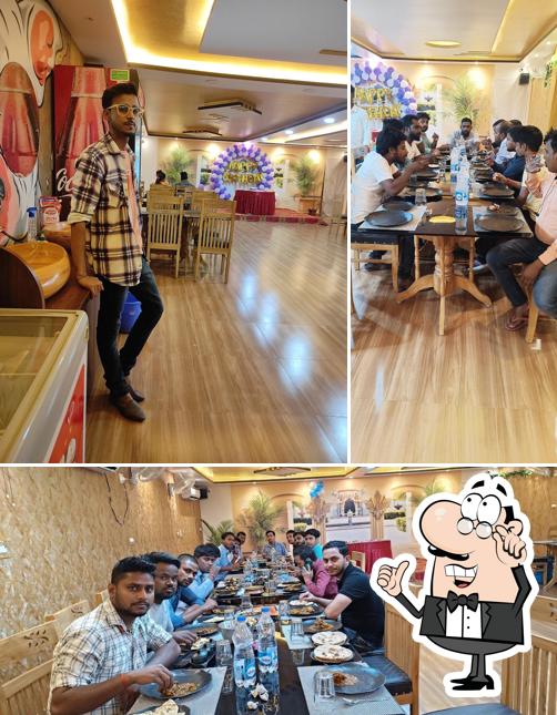 Take a seat at one of the tables at Haveli 21 Family Restaurant & Cafe