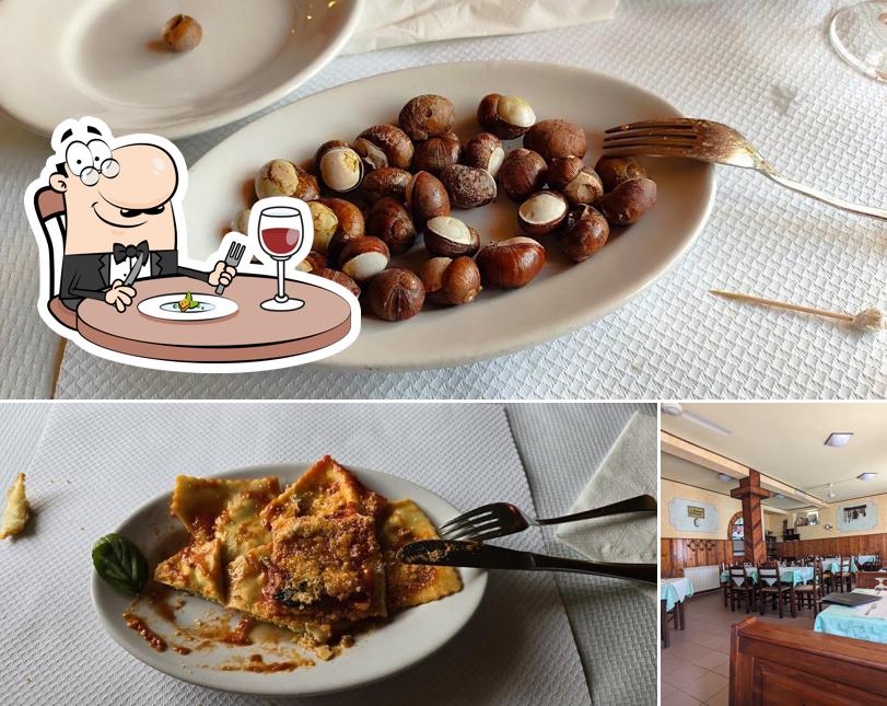 Tra le varie cose da Ristorante Pizzeria La Perla si possono trovare la cibo e interni
