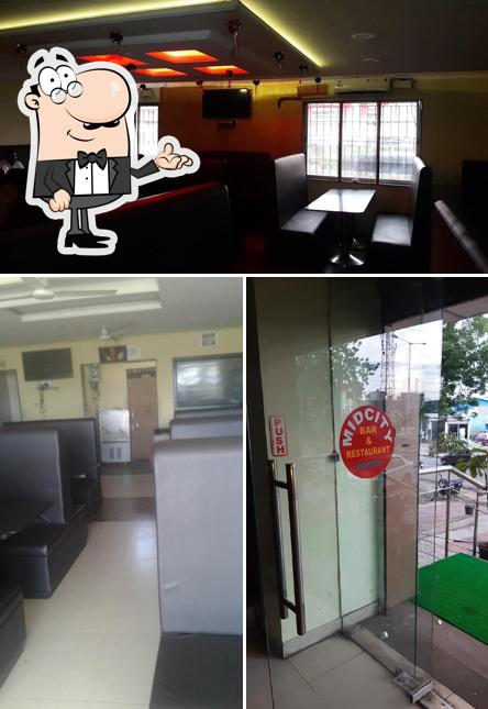 The interior of Mid City Bar & Multi Cuisine Restaurant
