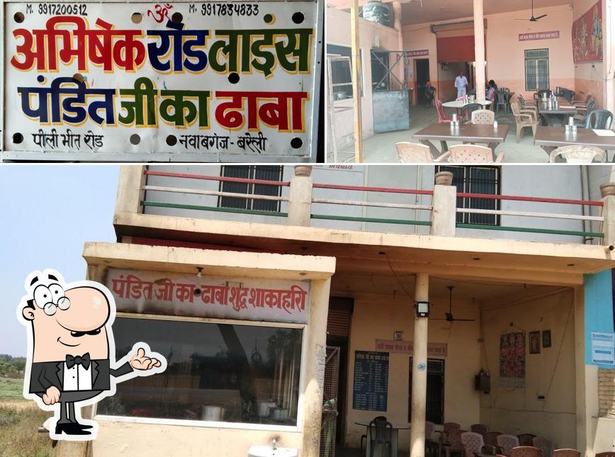 Take a seat at one of the tables at Pandit Ji Ka Shudh Shakahari Dhaba