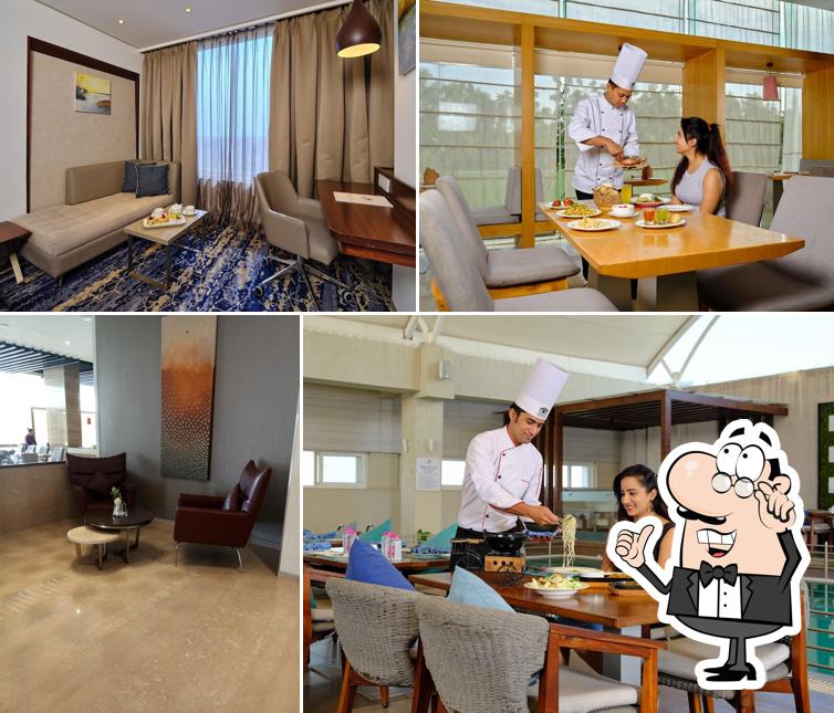 Take a seat at one of the tables at Sayaji Hotel Vadodara Take a seat at one of the tables at Sayaji Hotel Vadodara