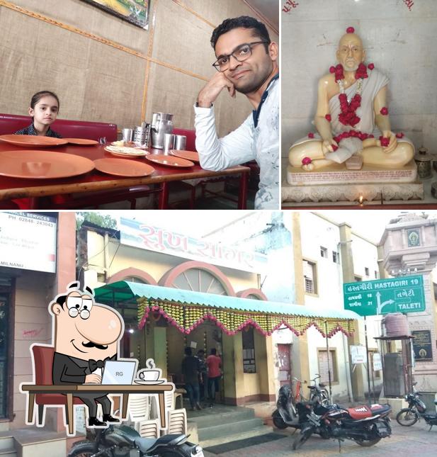 Take a seat at one of the tables at Sukh Sagar Restaurant