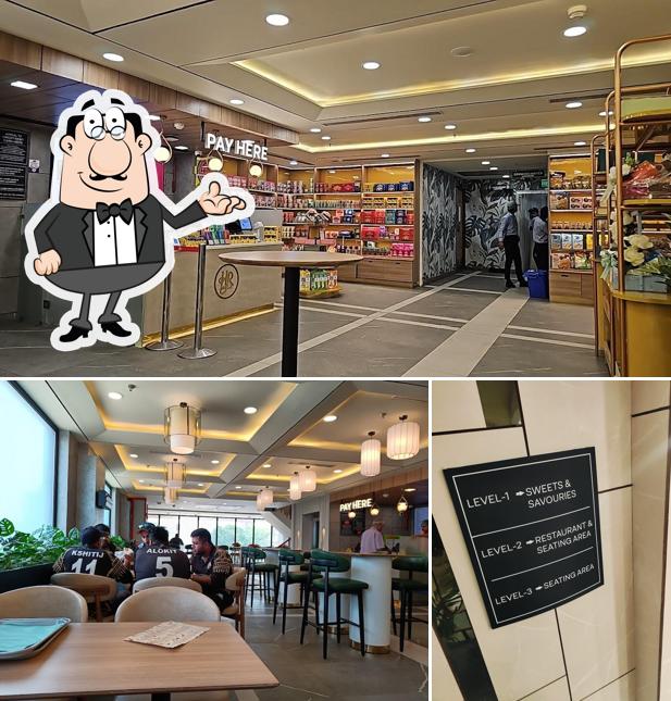 Take a seat at one of the tables at Haldiram's - Faridabad, Sector 16