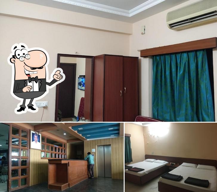 Take a seat at one of the tables at Sri Murugan Cafe and Hotels