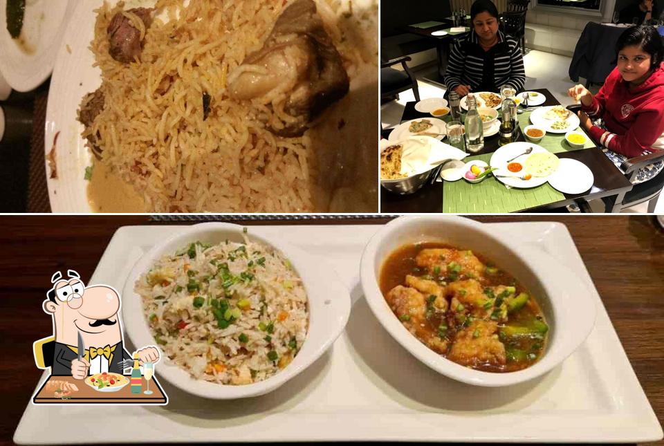 Check out the photo depicting food and dining table at Taj Bano