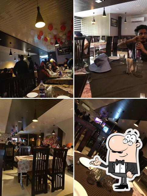 Take a seat at one of the tables at Uttam's Buffet and Restaurant