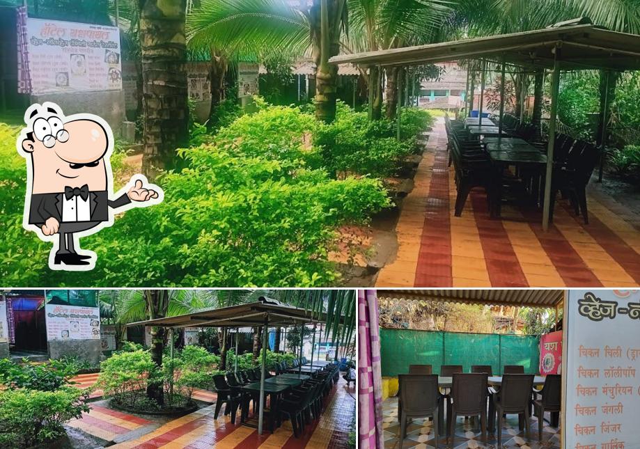 Take a seat at one of the tables at YashPayal Hotel