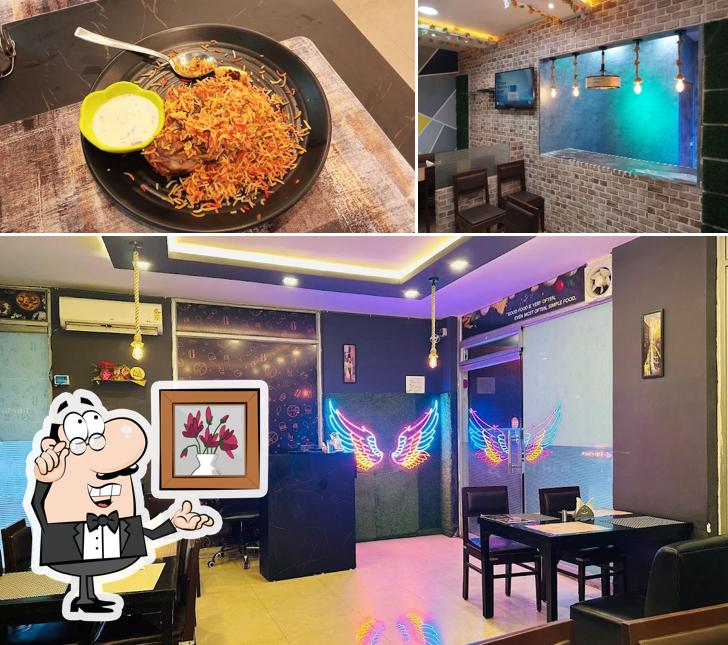 Check out the image showing interior and food at The Kitchen