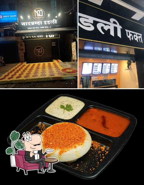 Check out the image displaying interior and food at Naadbramha idli Dehugaon