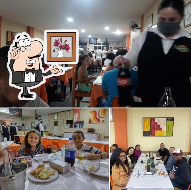 Sente em uma das mesas no Pizzaria Tarantella