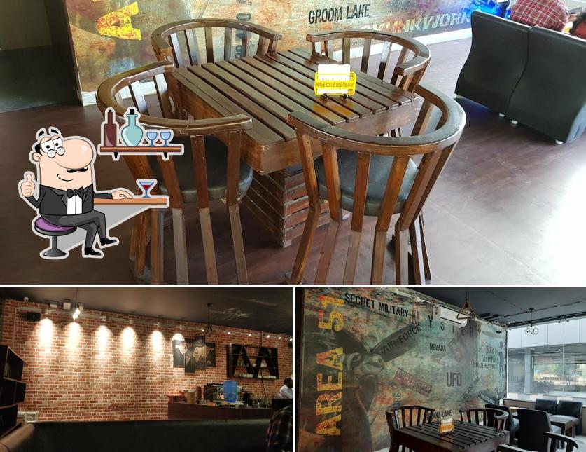 Take a seat at one of the tables at Area 51 - The café hideout