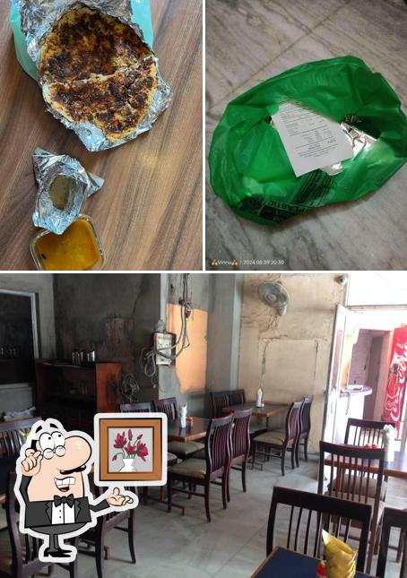 Take a seat at one of the tables at Mewar Restaurant