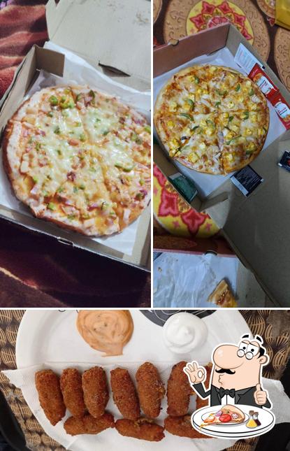 Try out pizza at Munchies Restaurant