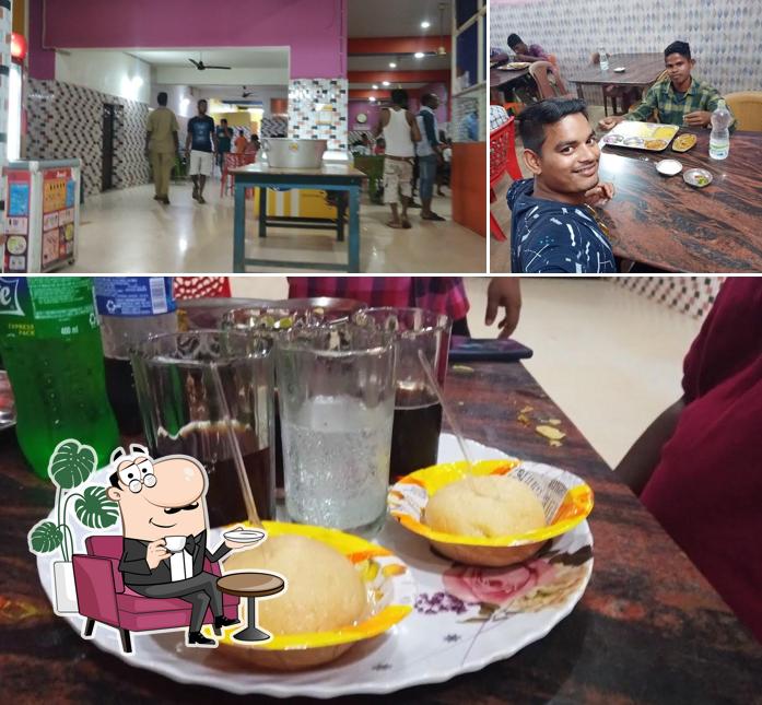 This is the image depicting interior and dining table at Hotel Pandit,DADHIMACHHA GADIA