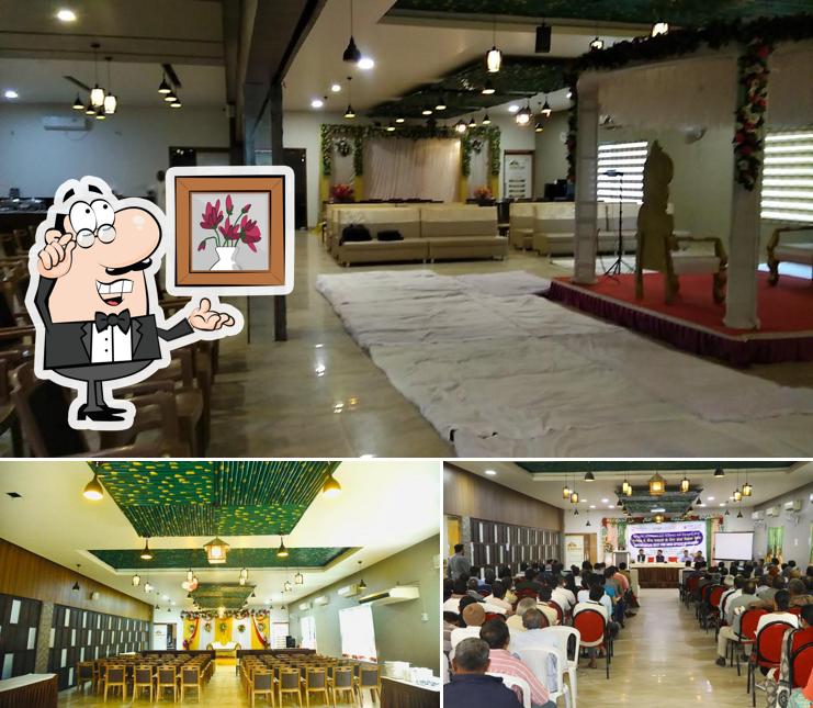 Take a seat at one of the tables at Satkar Garden Restaurant & Banquet Hall