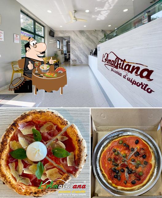 Dai un’occhiata alla foto che presenta la cibo e interni di Pizzeria Amalfitana