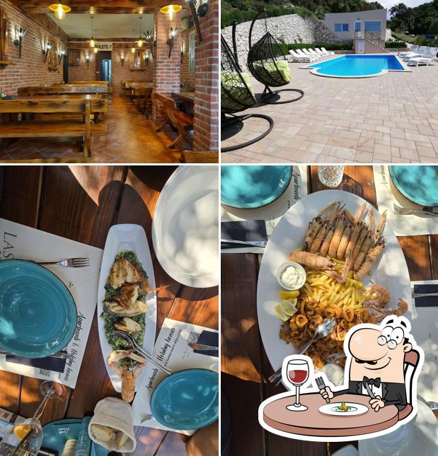 Guarda la foto che mostra la cibo e interni di Apartmani Lastura