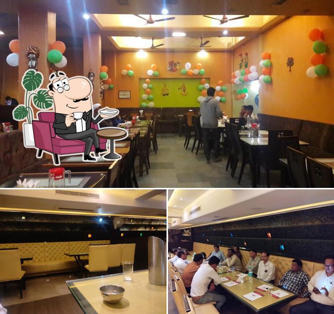 Take a seat at one of the tables at Majestic Plaza