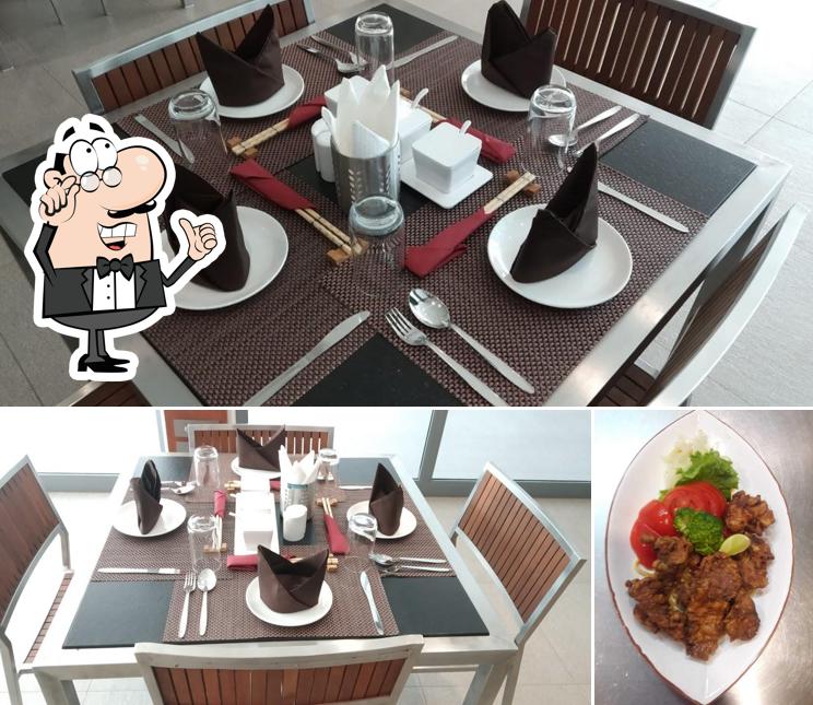 Take a seat at one of the tables at ASAGAO BY YUHI - THE JAPANESE RESTAURANT
