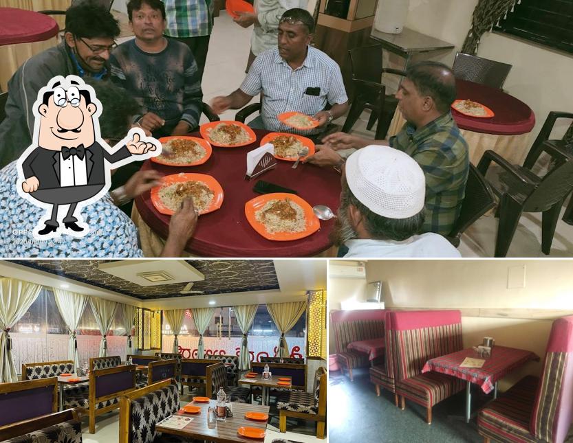 Take a seat at one of the tables at Al Taj Hotel Restaurant near me Hotel Best hotel in Hubli