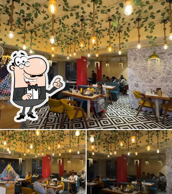 Take a seat at one of the tables at Indoriyan Pizza Castel