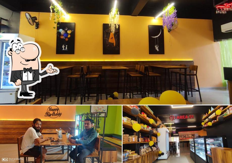 Take a seat at one of the tables at Cafe Area-51