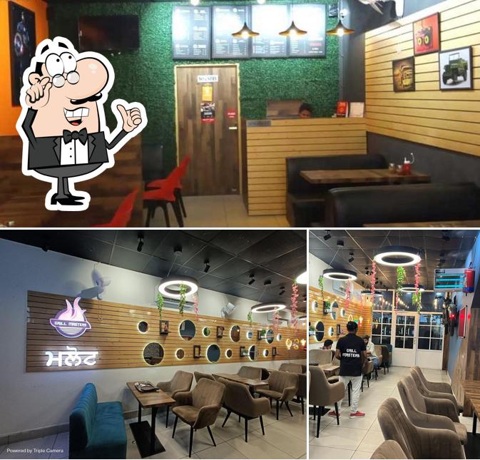 Take a seat at one of the tables at Grill Masters Malout